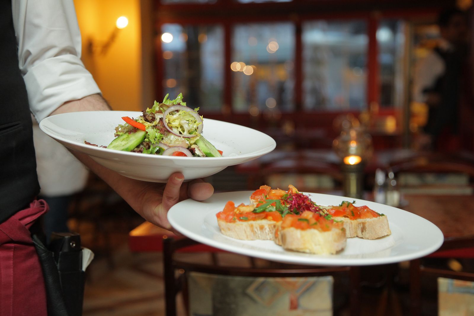Freshly prepared dishes being served in a restaurant
